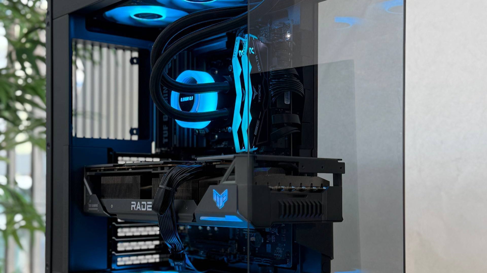 Computer case with blue LED lighting on a white surface